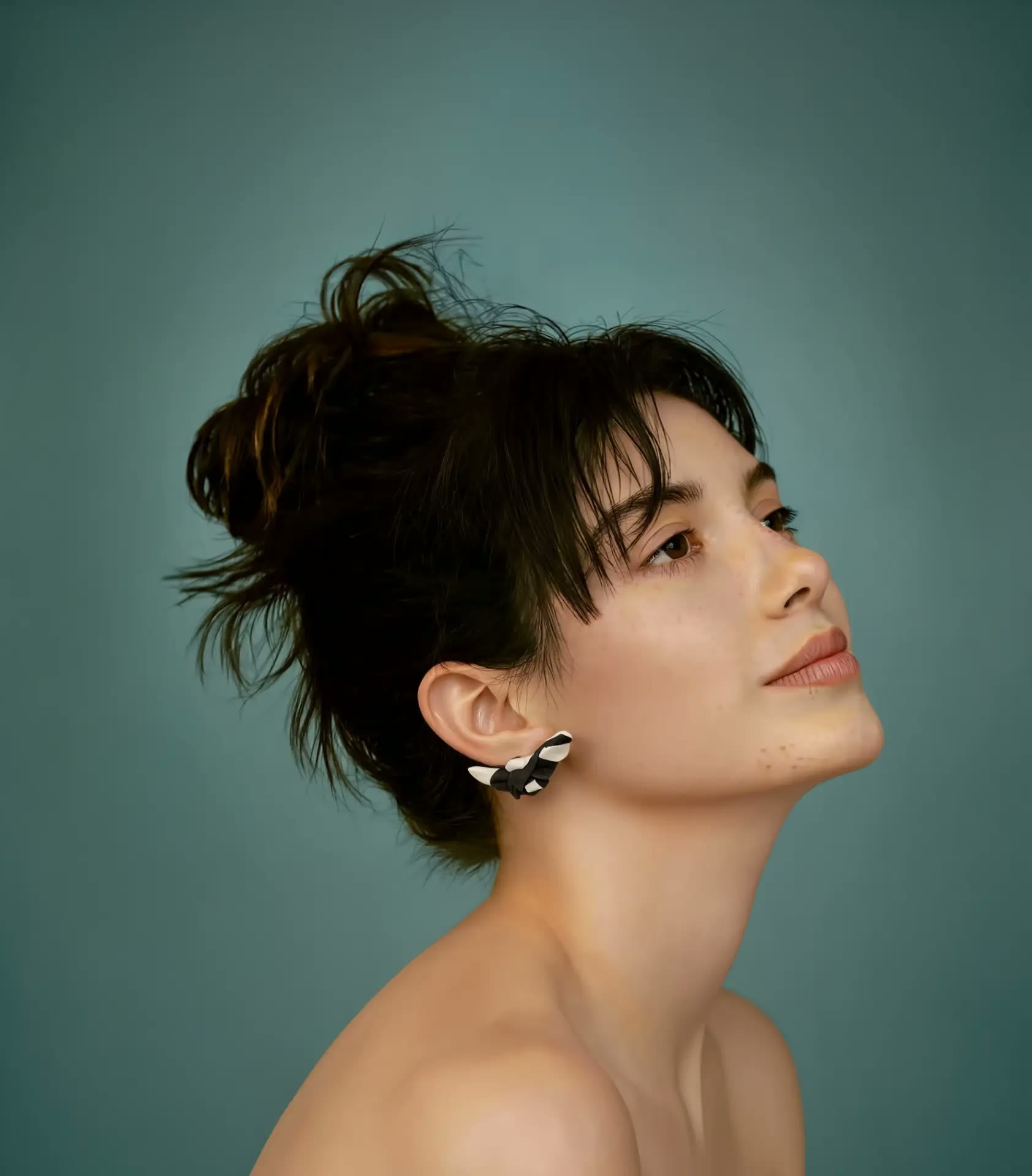 Model profile wearing Papillon earrings
