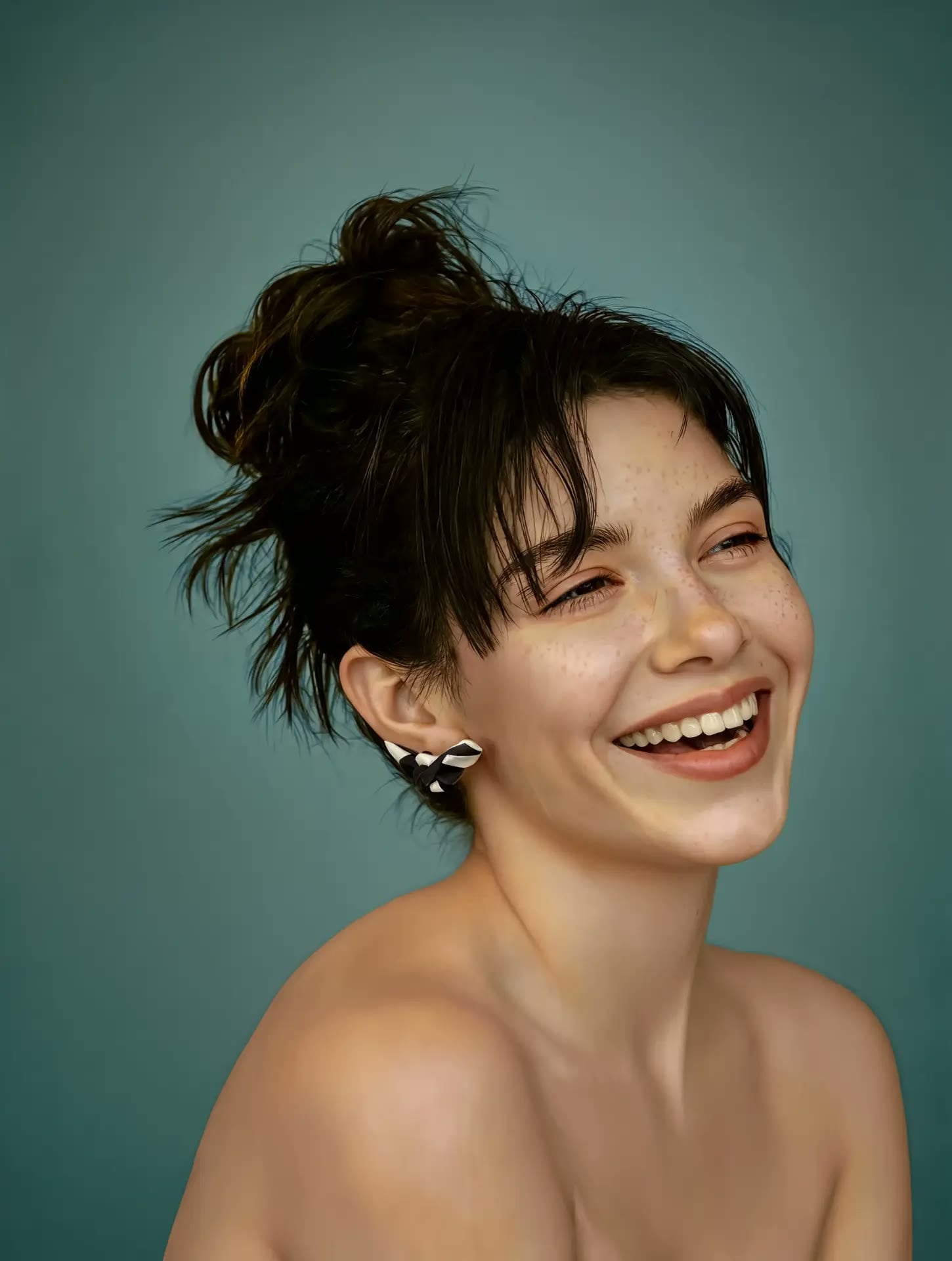 Model laughing wearing Papillon earrings